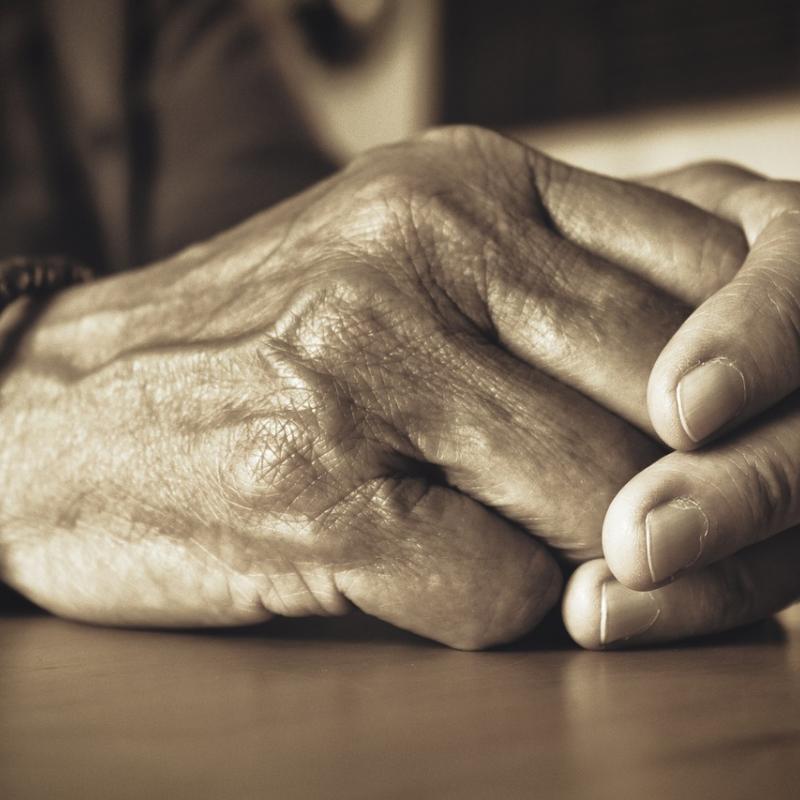 Hands on a table top