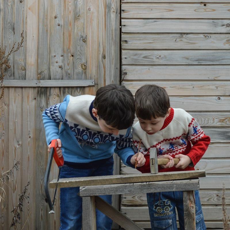 two kids engaging in work