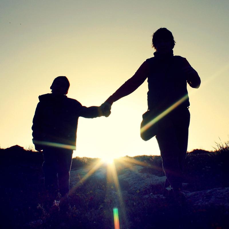 Parent and child holding hands